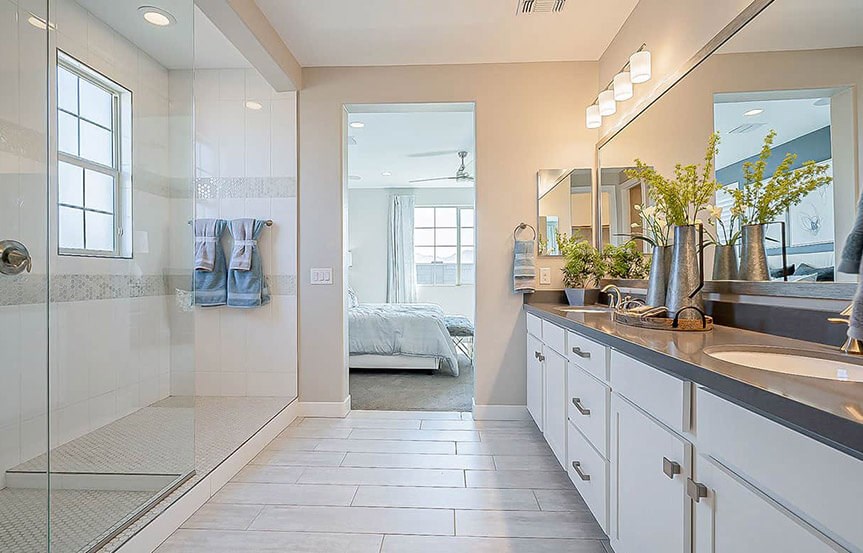Castellano model home Primary Bath by Brightland Homes at Alamar community in Avondale, AZ